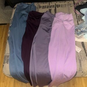 Set of Four Leggings in Blue, Purple, and Pink